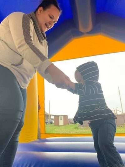 Mom and Son Playing at Company picnic