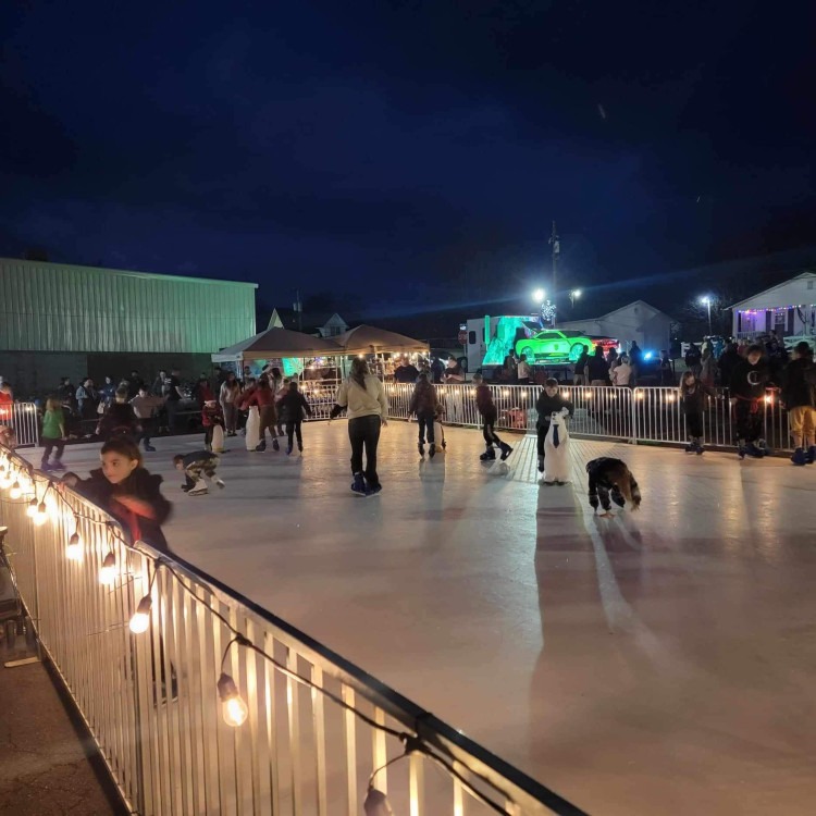 Synthetic ice skating rink rental at an evening event